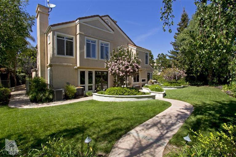 11210 Bentcreek Road Moorpark, CA 93021 - Photo 22 of 22 a front view of a house with a yard and potted plants