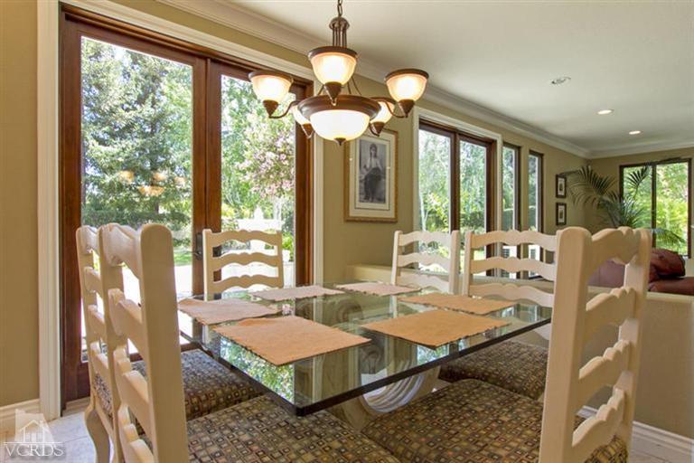 11210 Bentcreek Road Moorpark, CA 93021 - Photo 9 of 22 a view of a dining room with furniture wooden floor and chandelier