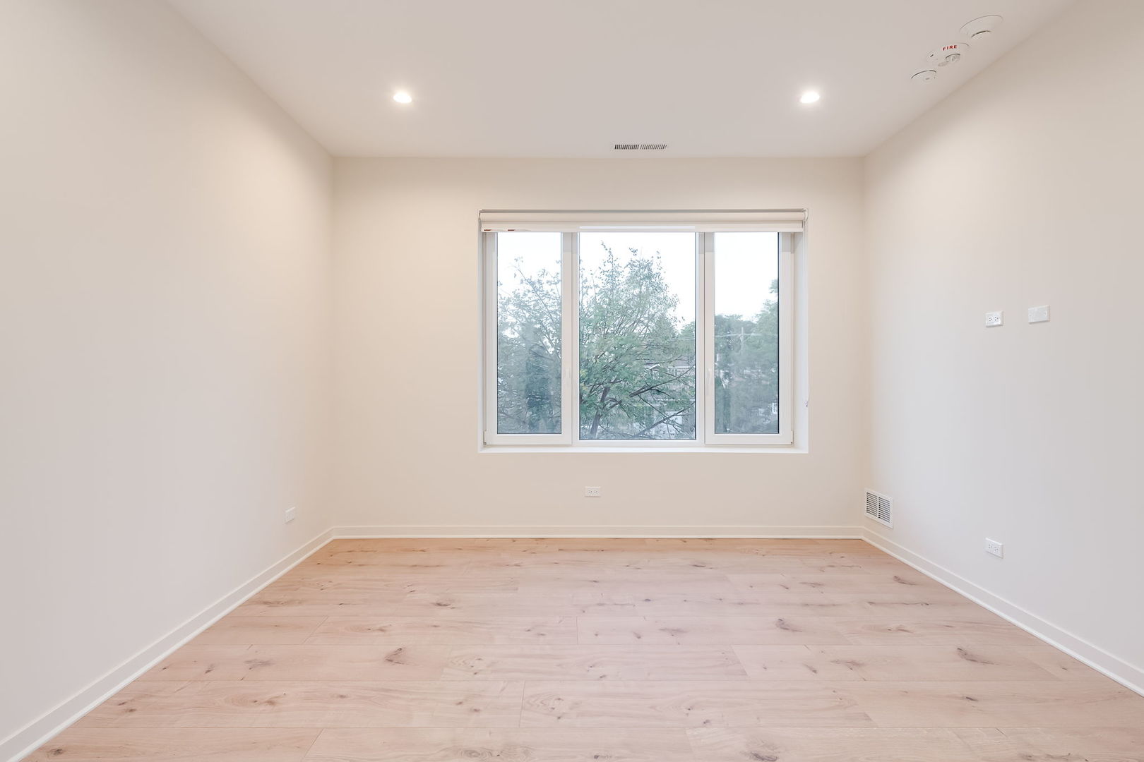 8015 West Belmont Avenue, Unit 104 River Grove, IL 60171 - Photo 10 of 35 an empty room with a window