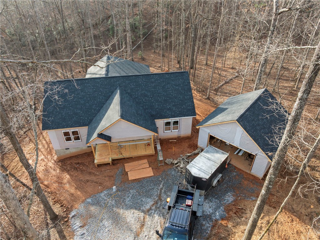 110 Gabriel Way Pickens, SC 29671 - Photo 5 of 12 This newly constructed home features a classic shingle roof amidst a tranquil wooded setting.