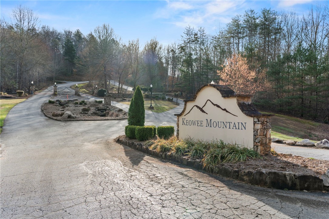 110 Gabriel Way Pickens, SC 29671 - Photo 6 of 12 The welcoming entrance to Keowee Mountain, featuring a grand sign and gated access.
