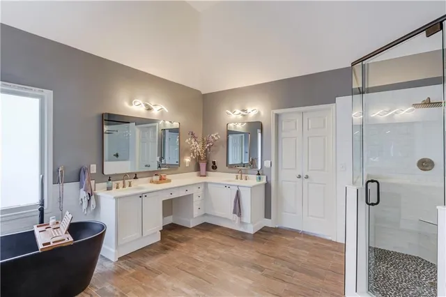 a bedroom with a bed and chair