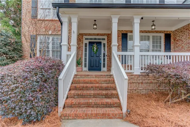 a view of a livingroom with furniture and stairs