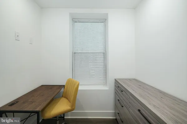 a view of a workspace with furniture