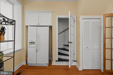 a bedroom with a bed a table and chair