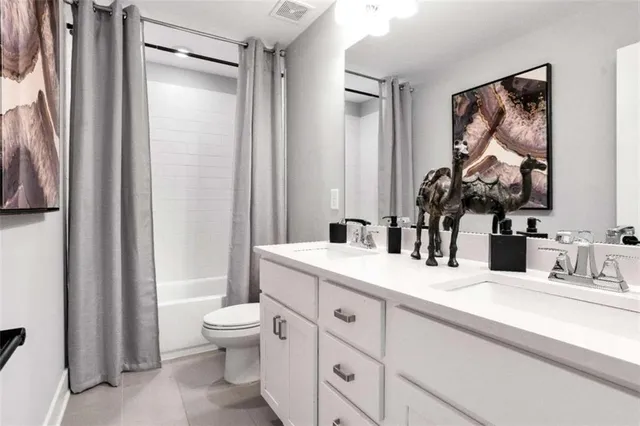 a bathroom with a toilet a sink and a mirror