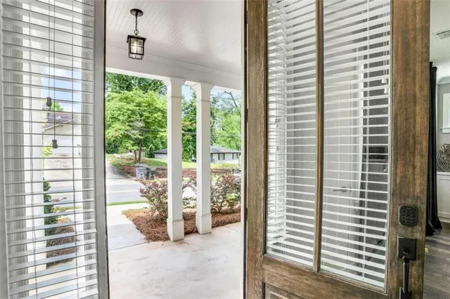 a view of a room with a large window