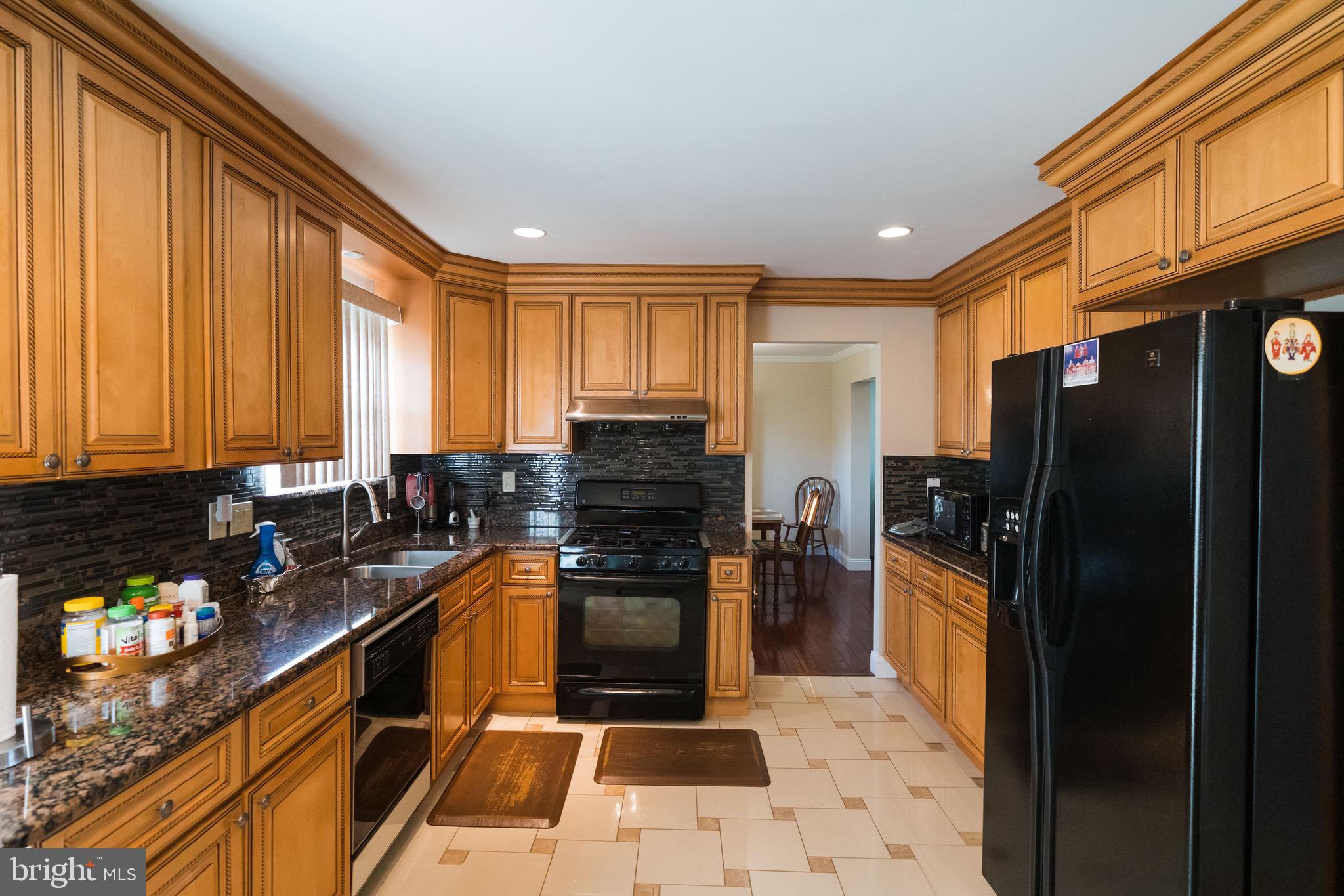 2 Danbridge Drive Horsham, PA 19044 - Photo 20 of 71 a kitchen with granite countertop a refrigerator a stove a sink a washer and dryer