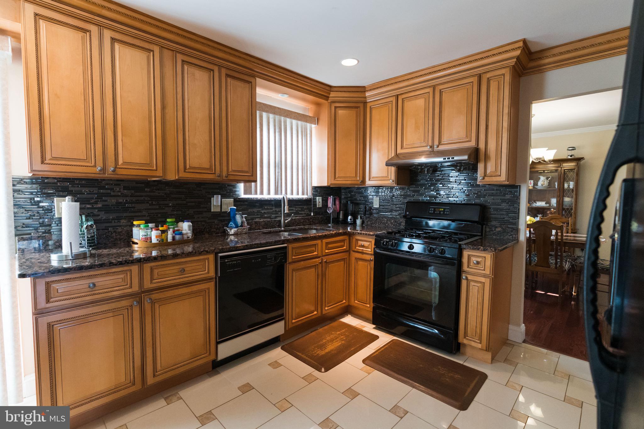 2 Danbridge Drive Horsham, PA 19044 - Photo 23 of 71 a kitchen with stainless steel appliances granite countertop a stove a sink and a refrigerator