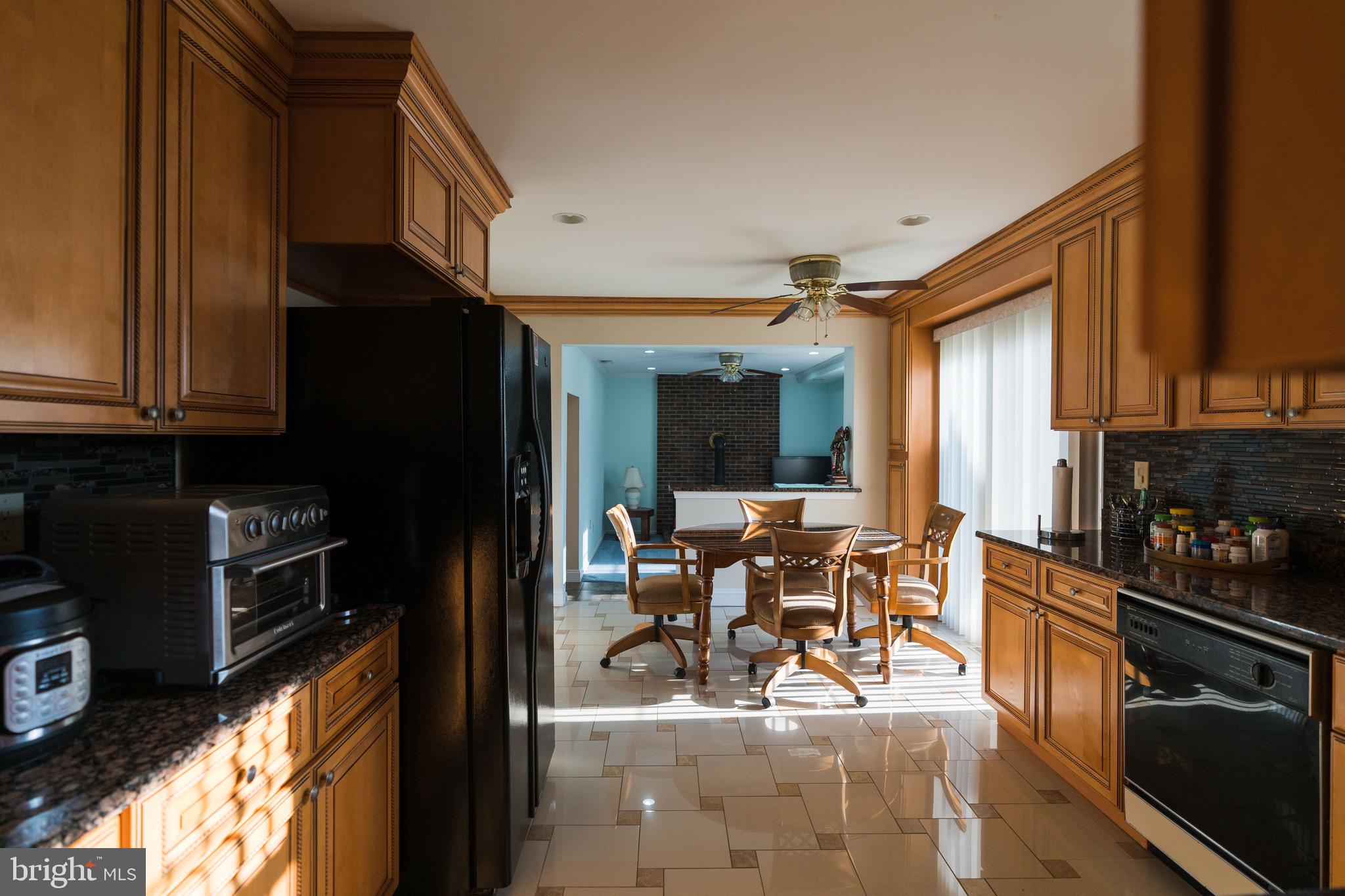 2 Danbridge Drive Horsham, PA 19044 - Photo 28 of 71 a kitchen with stainless steel appliances granite countertop a refrigerator stove top oven dining table and chairs