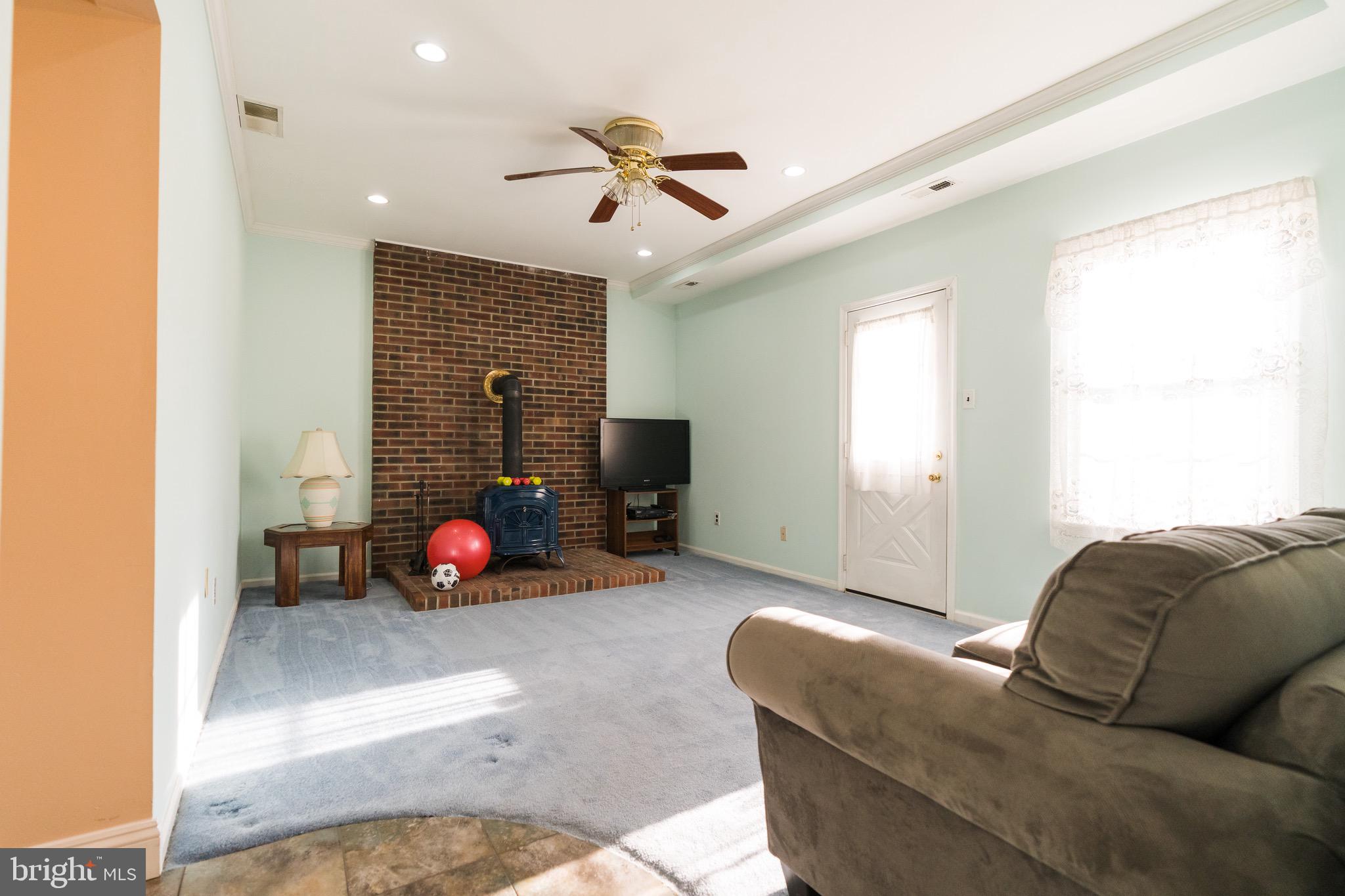 2 Danbridge Drive Horsham, PA 19044 - Photo 35 of 71 a living room with furniture a fireplace and a chandelier