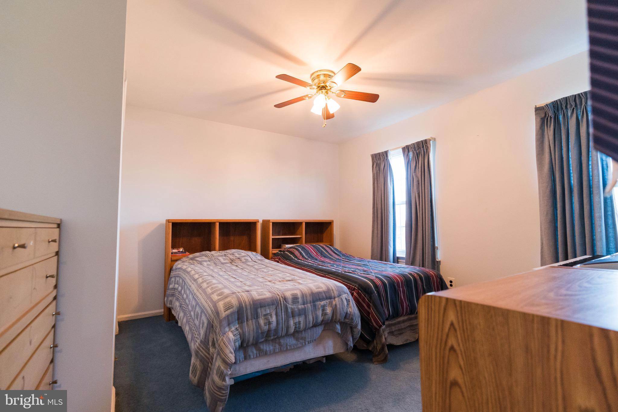 2 Danbridge Drive Horsham, PA 19044 - Photo 57 of 71 a bedroom with a bed and a chandelier