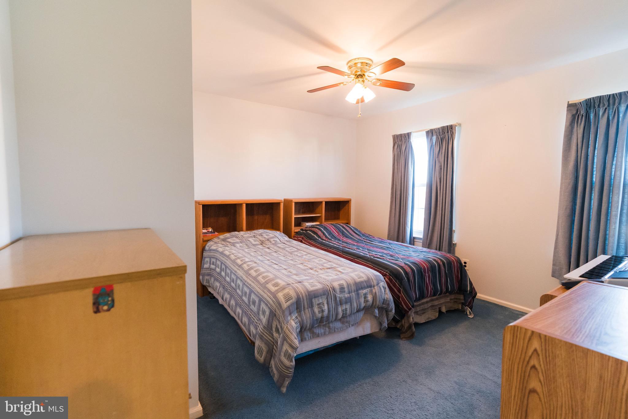 2 Danbridge Drive Horsham, PA 19044 - Photo 58 of 71 a bedroom with a bed and a chandelier