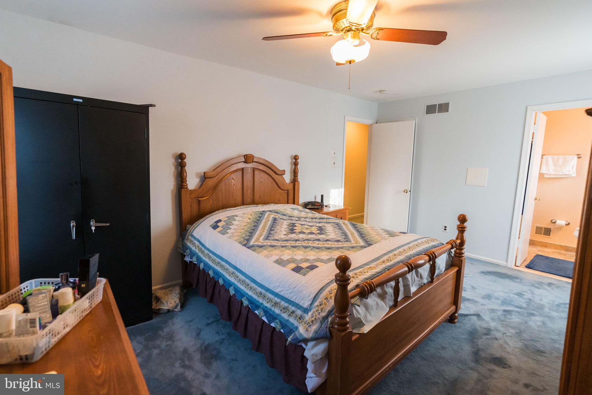 2 Danbridge Drive Horsham, PA 19044 - Photo 60 of 71 a bedroom with a bed and a chandelier