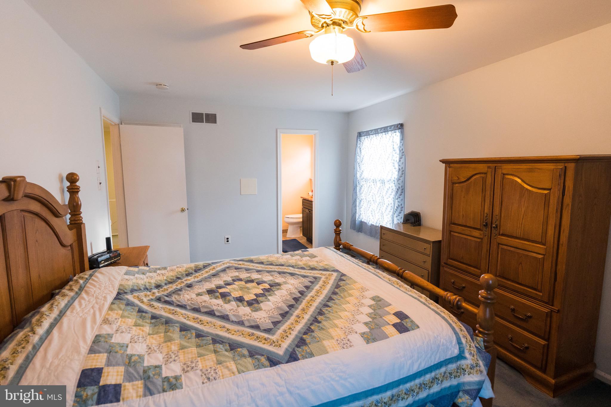 2 Danbridge Drive Horsham, PA 19044 - Photo 64 of 71 a bedroom with a large bed and a chandelier