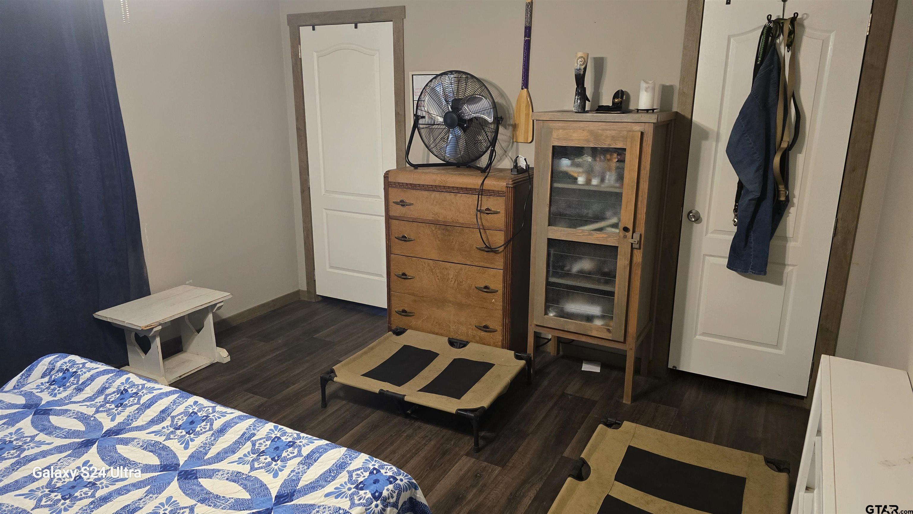 873 East Texas Road Lufkin, TX 75901 - Photo 11 of 12 a living room with a bed furniture and a window
