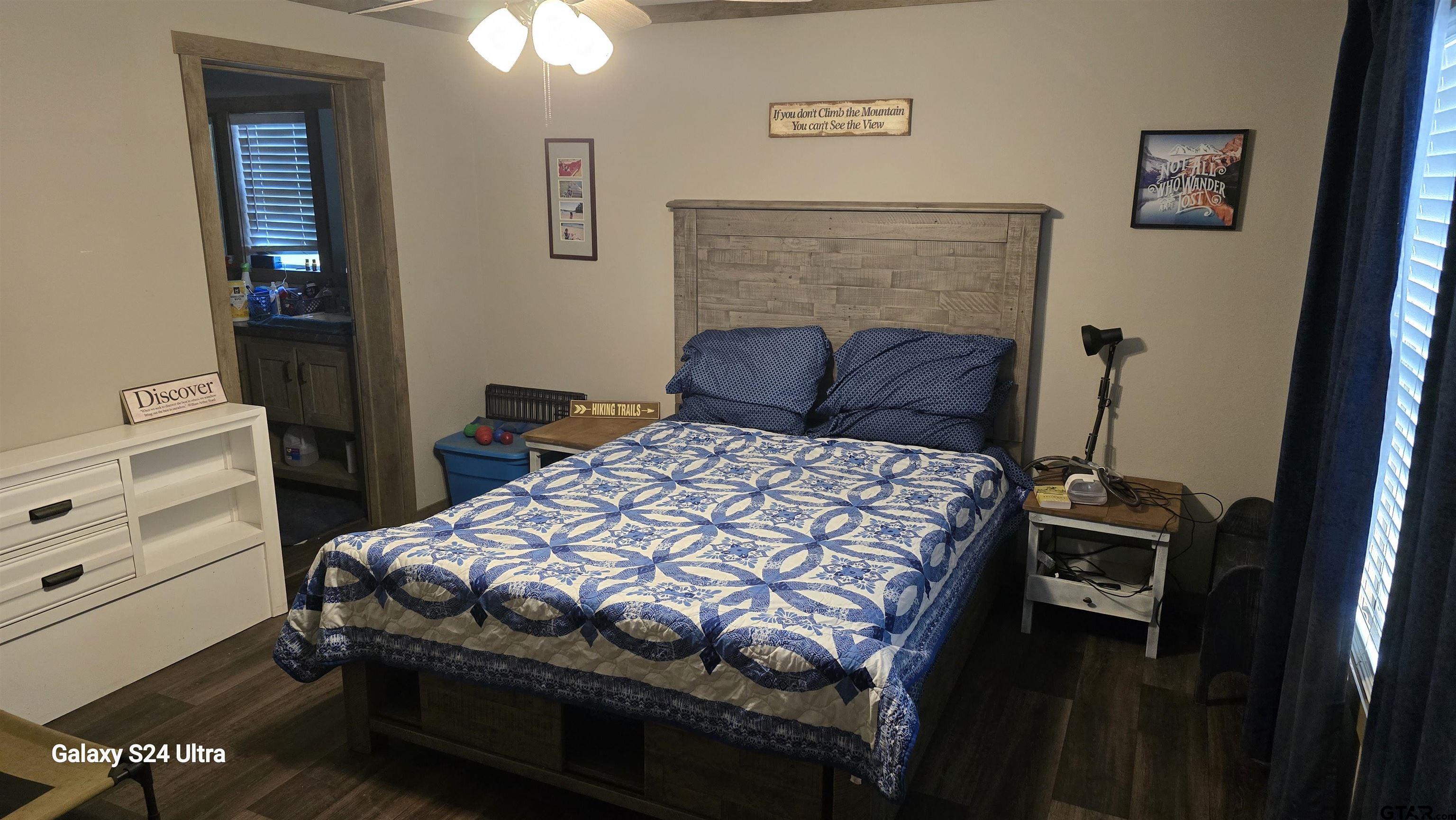 873 East Texas Road Lufkin, TX 75901 - Photo 12 of 12 a bedroom with a bed and furniture