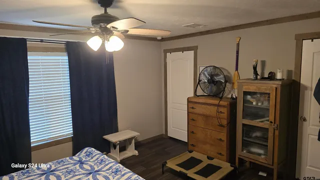 a living room with a bed furniture and a window