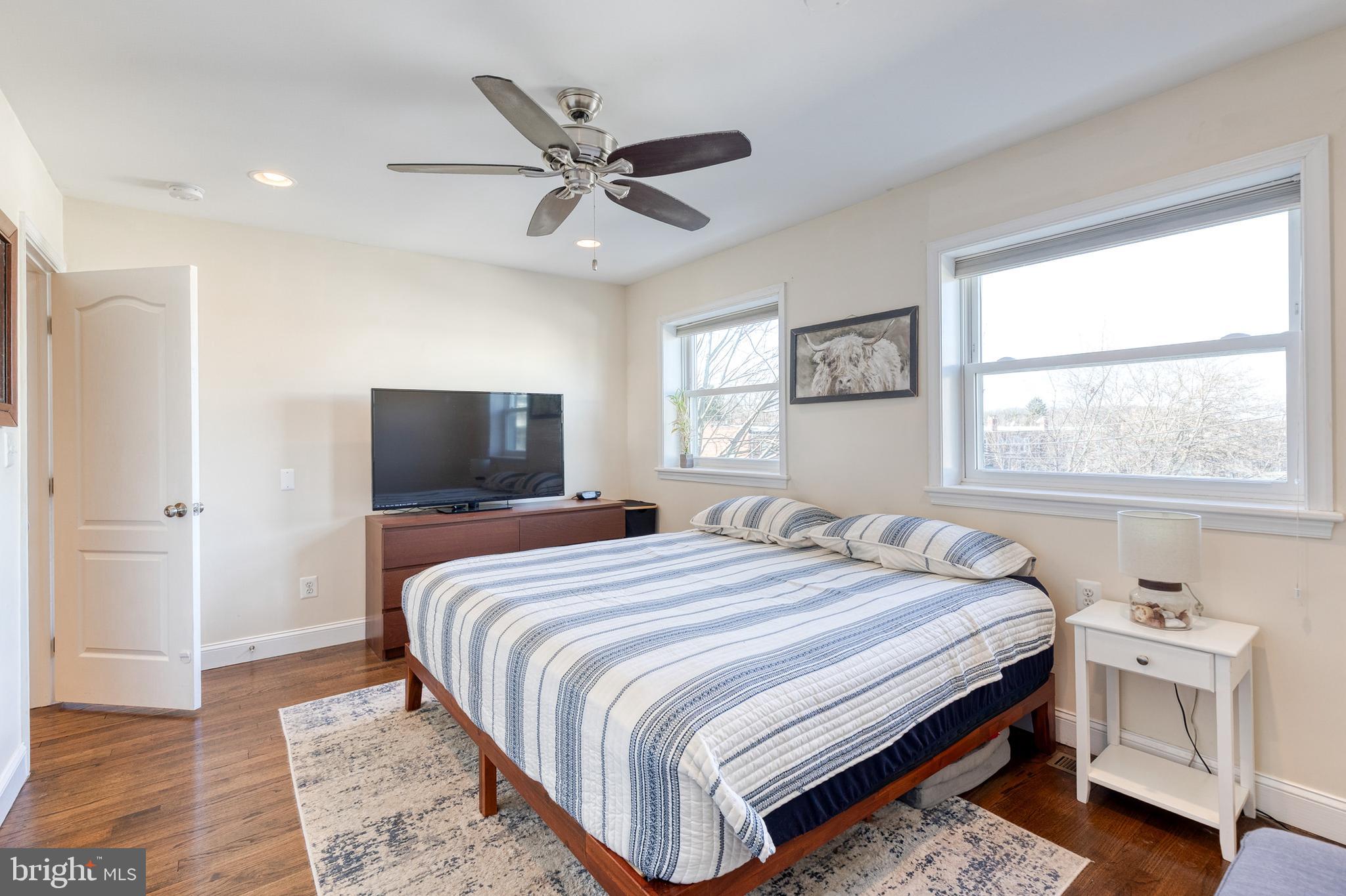 1205 Roland Heights Avenue Baltimore, MD 21211 - Photo 15 of 36 a bedroom with a bed and a tv