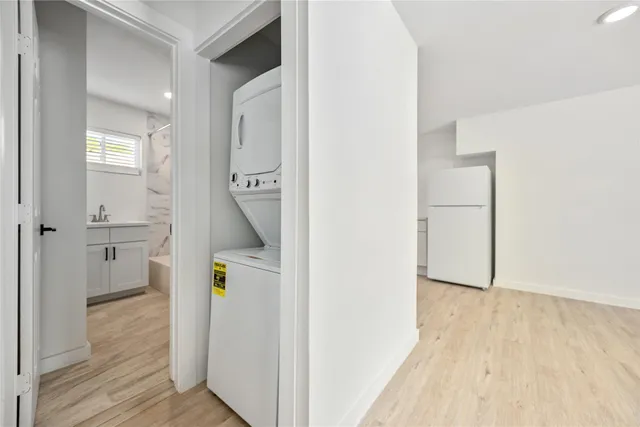 a view of hallway with wooden floor