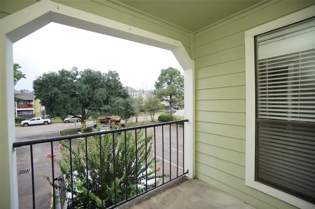 a view of a balcony with a street