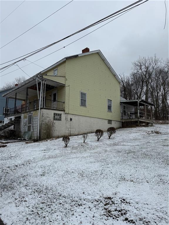 348 Musick Street Hannastown, PA 15635 - Photo 2 of 20 a backyard of a house with barbeque oven and bench