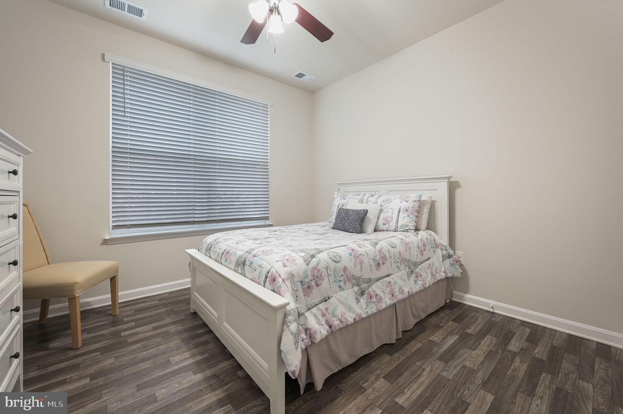 157 Clear Stream Drive Dover, DE 19904 - Photo 12 of 17 a bedroom with a bed and window
