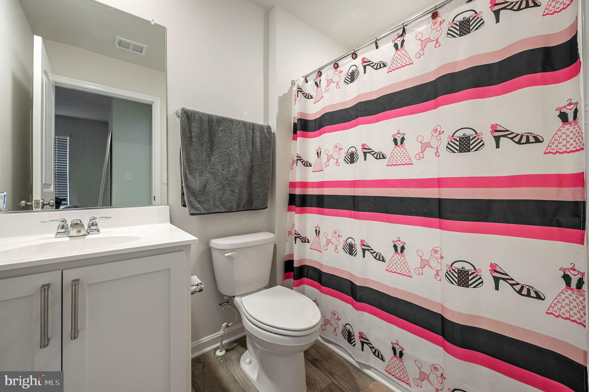157 Clear Stream Drive Dover, DE 19904 - Photo 15 of 17 a bathroom with a sink and a toilet