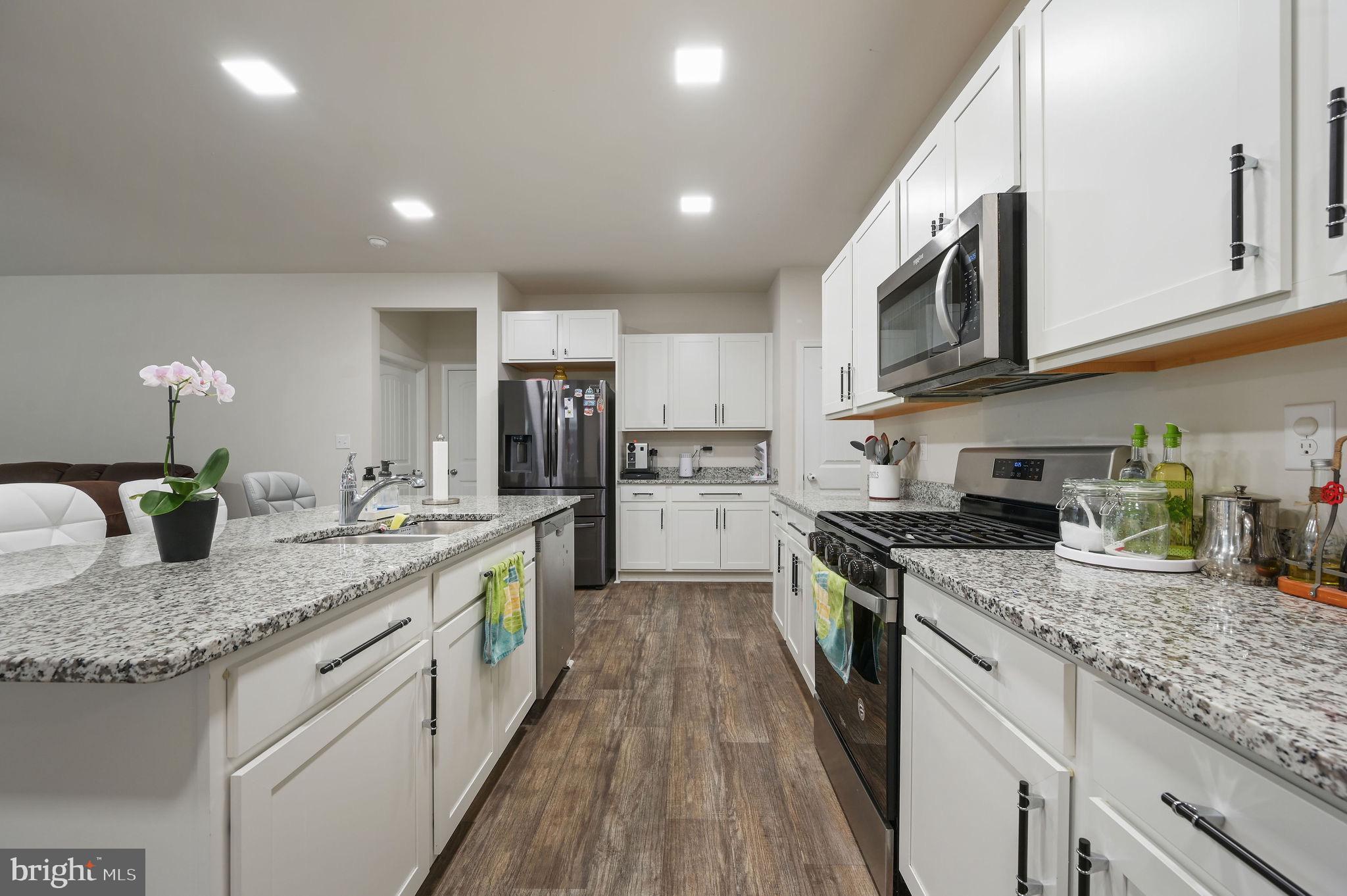 157 Clear Stream Drive Dover, DE 19904 - Photo 3 of 17 a large kitchen with stainless steel appliances granite countertop a lot of counter space