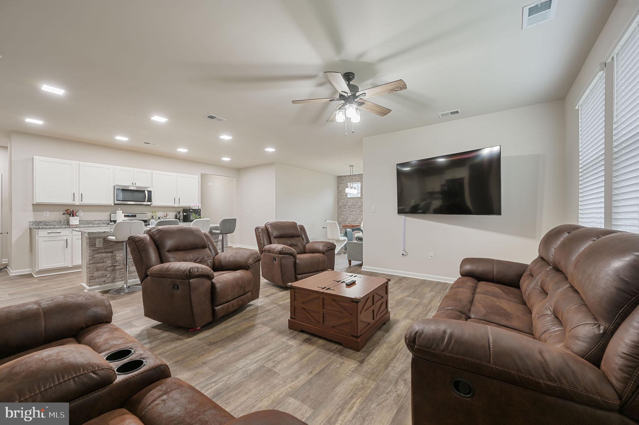 157 Clear Stream Drive Dover, DE 19904 - Photo 6 of 17 a living room with furniture kitchen view and a flat screen tv