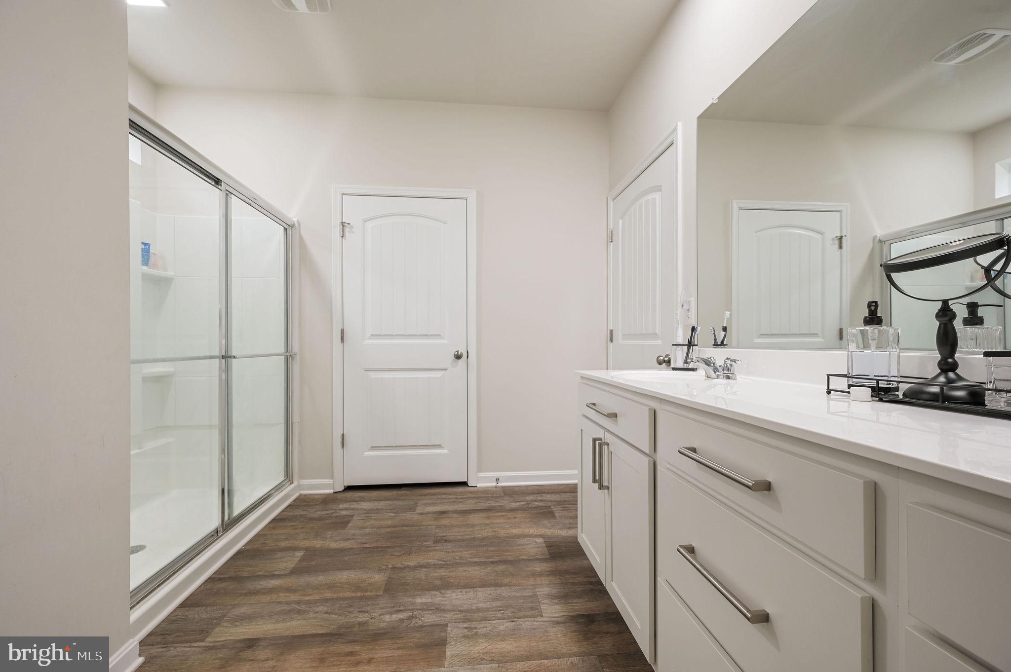 157 Clear Stream Drive Dover, DE 19904 - Photo 8 of 17 a bathroom with a sink and a mirror