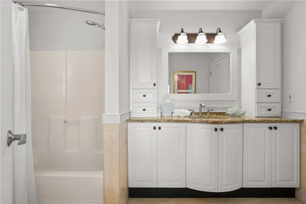 a bathroom with a sink and a mirror