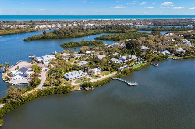 an aerial view of a house with a lake view