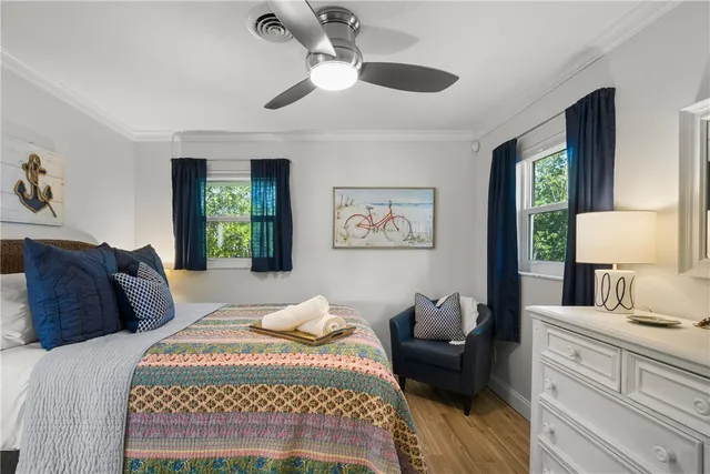 a bedroom with a bed and a couch