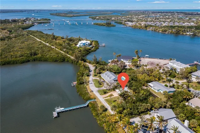 an aerial view of a house with a ocean view