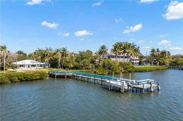 a view of a lake with boats and trees