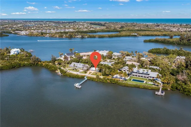 an outdoor space with lounge chair and water view