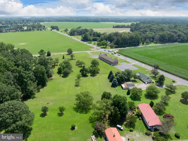 an aerial view of a houses with outdoor space and street view
