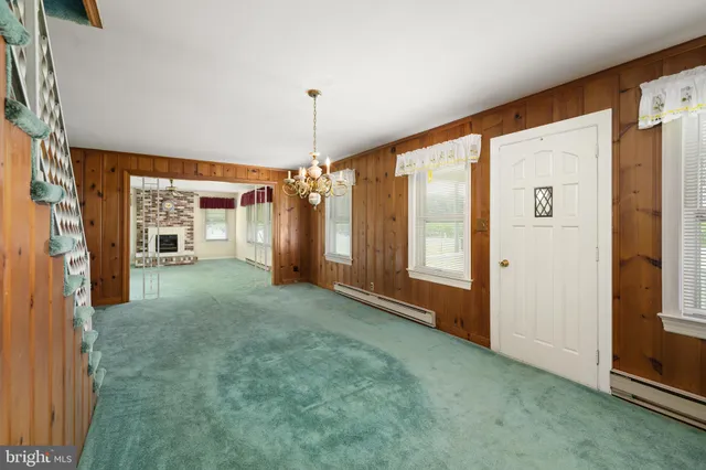 a view of empty room with floor to ceiling window
