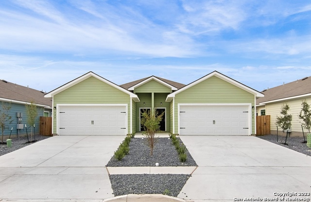a view of garage and yard