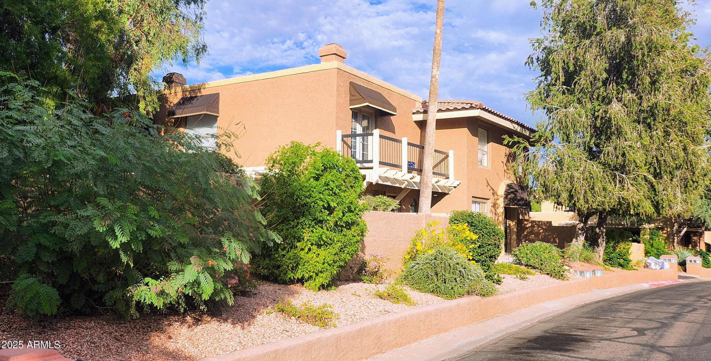 730 East North Lane, Unit 2 Phoenix, AZ 85020 - Photo 15 of 17 front view of a house with a yard