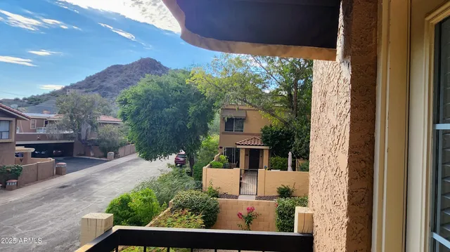 a view of house with a yard