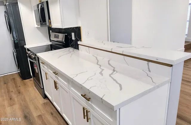 view of microwave and cabinets