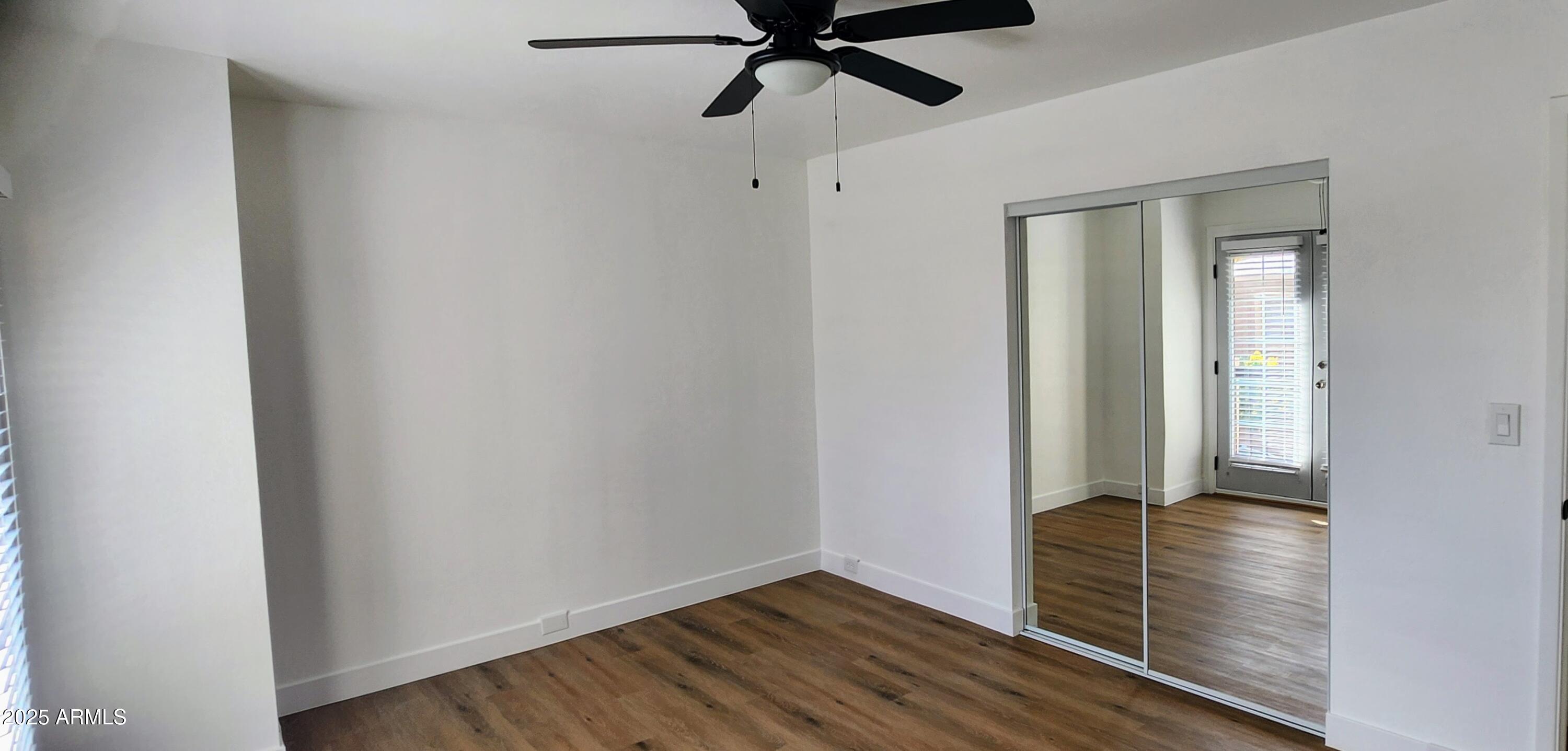 730 East North Lane, Unit 2 Phoenix, AZ 85020 - Photo 9 of 17 a view of an empty room and wooden floor