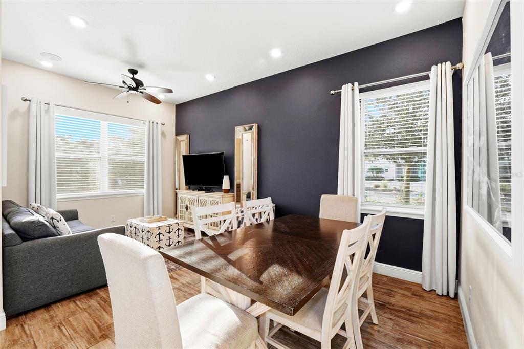 8098 Knee Deep Road Kissimmee, FL 34747 - Photo 11 of 40 a view of a dining room with furniture window and wooden floor