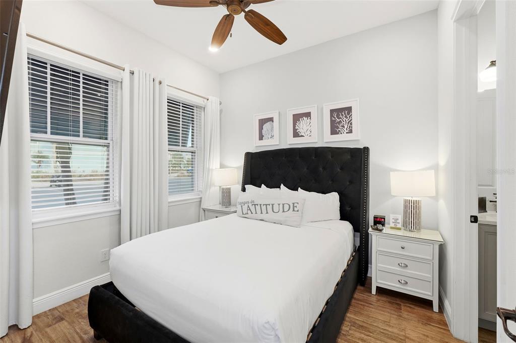 8098 Knee Deep Road Kissimmee, FL 34747 - Photo 21 of 40 a bedroom with a large bed and a window