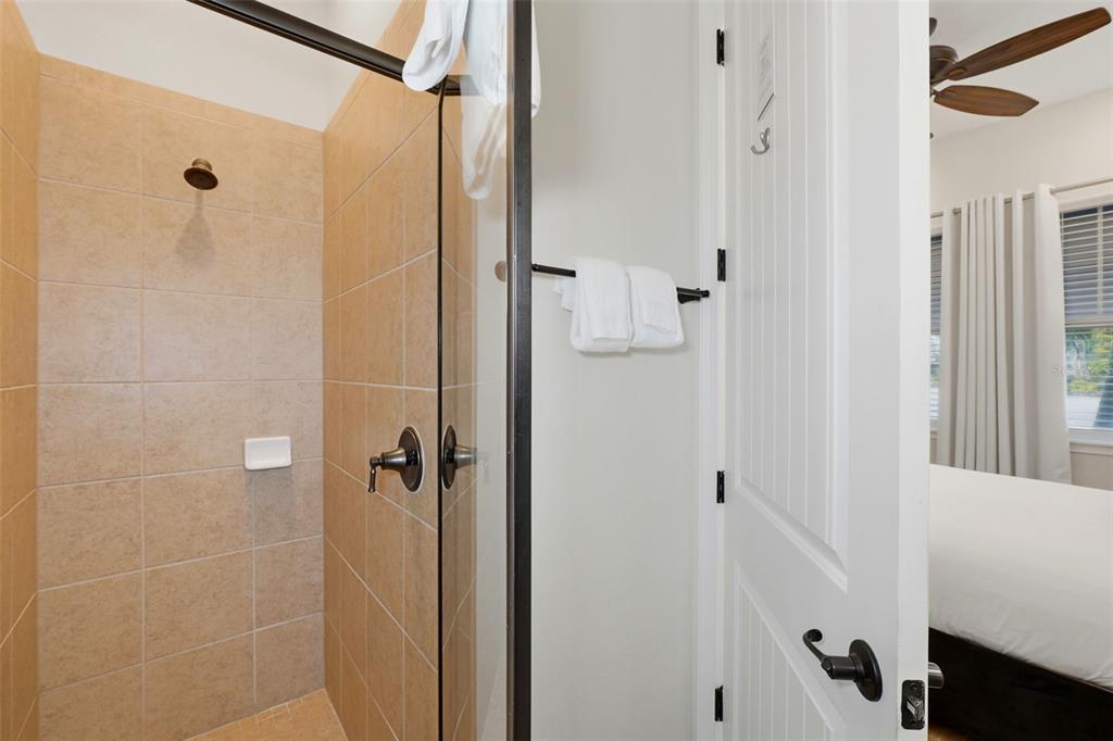 8098 Knee Deep Road Kissimmee, FL 34747 - Photo 23 of 40 a bathroom with a shower