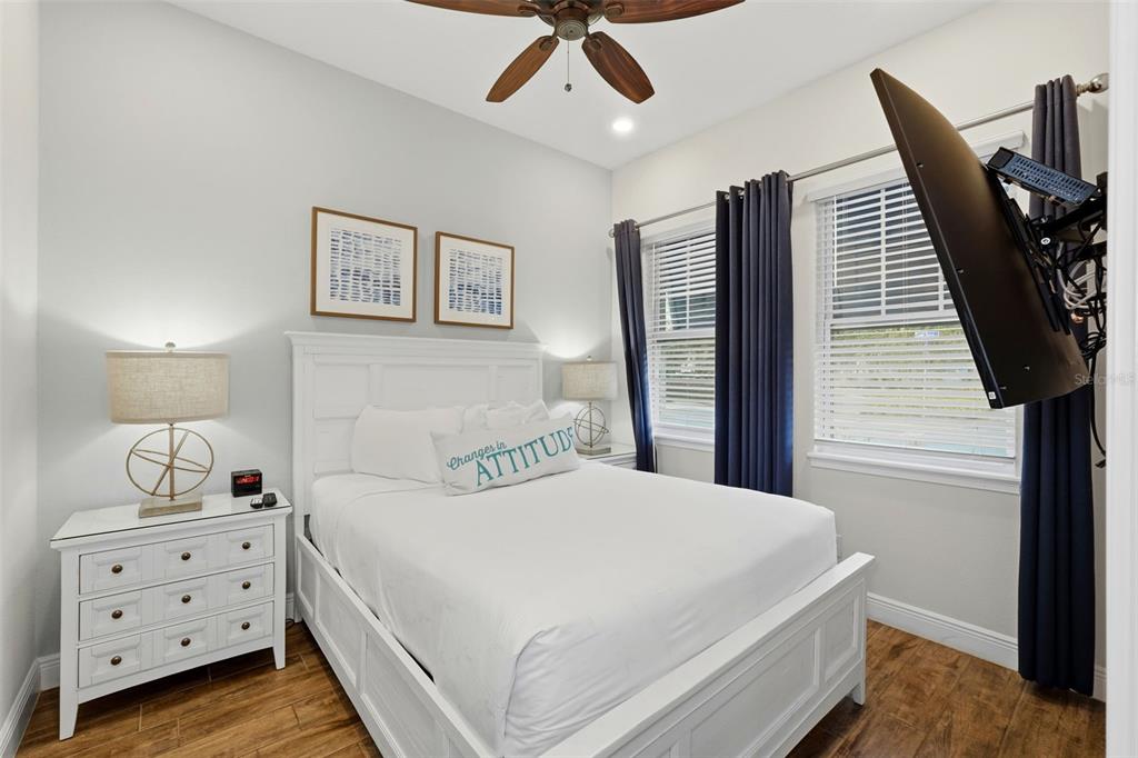 8098 Knee Deep Road Kissimmee, FL 34747 - Photo 24 of 40 a bedroom with a bed and wooden floor