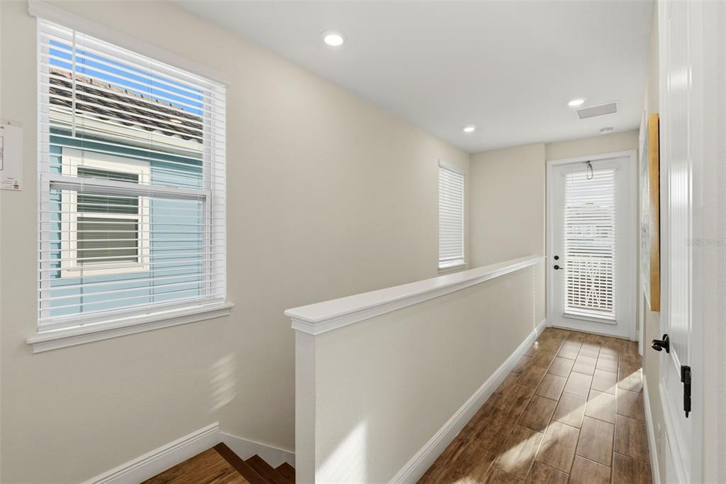 8098 Knee Deep Road Kissimmee, FL 34747 - Photo 26 of 40 a view of hallway with windows