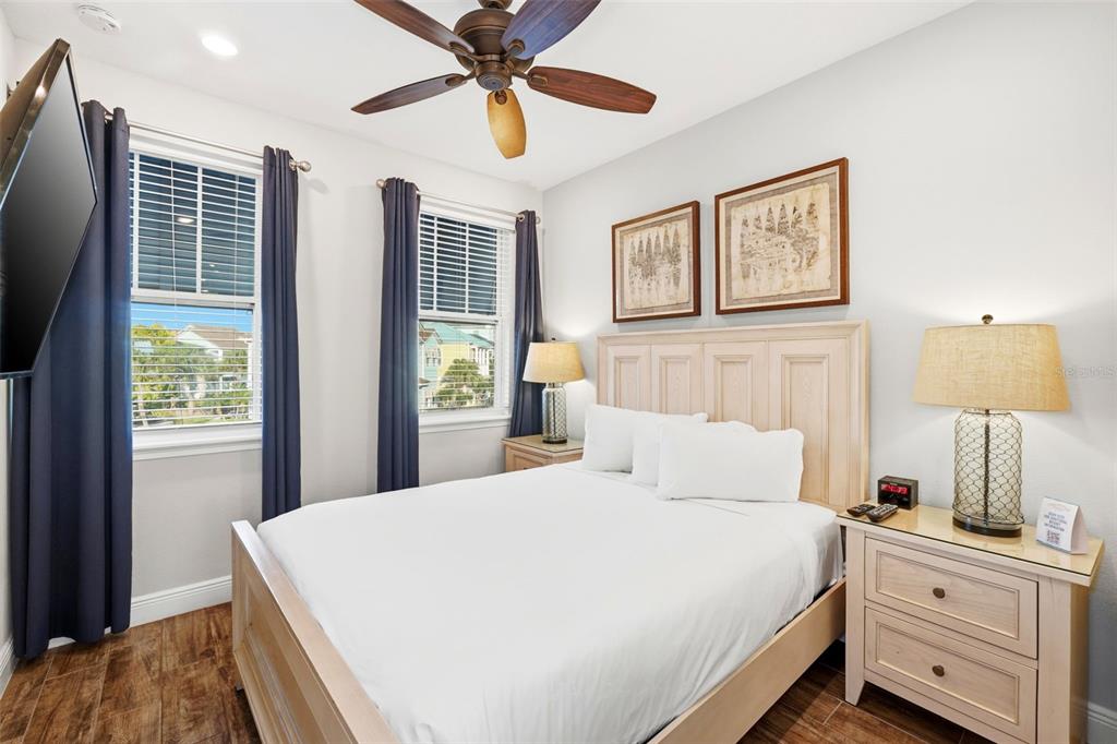 8098 Knee Deep Road Kissimmee, FL 34747 - Photo 27 of 40 a bedroom with a large bed and a window